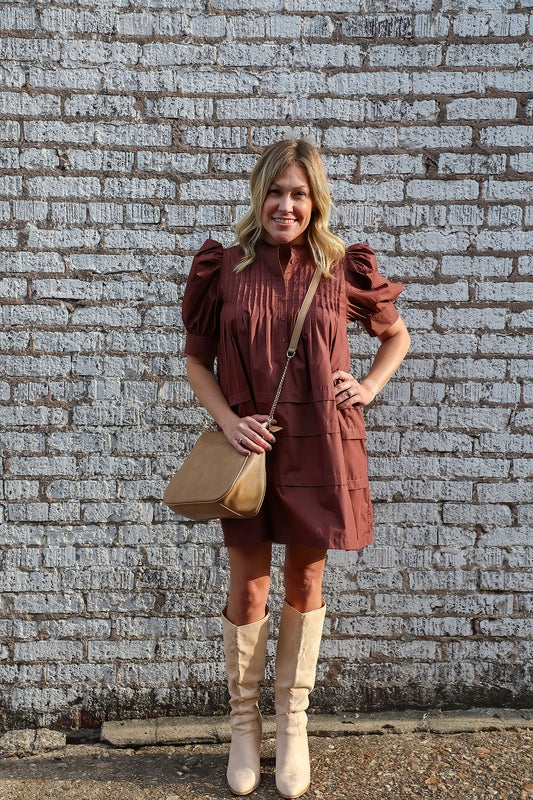 Solid pin tucked short sleeve mini dress w/ pockets, puff sleeves, & button detail at bust